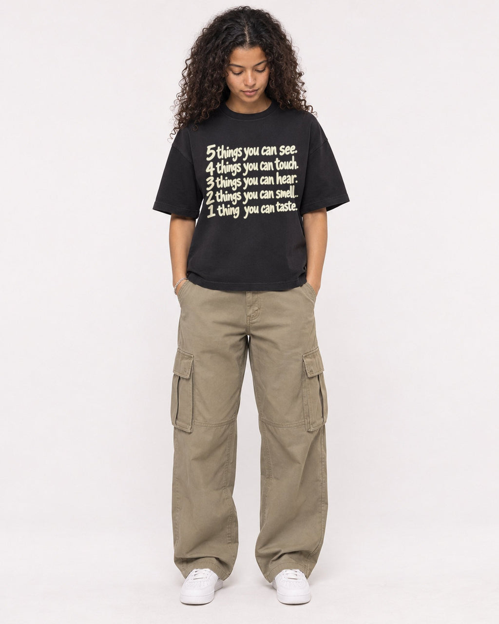 Mockup Boxy Heavyweight Tee Black female full-body 10